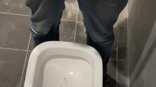 Man peeing in toilet 