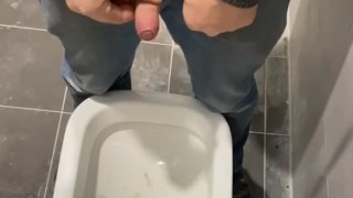 Man peeing in toilet 