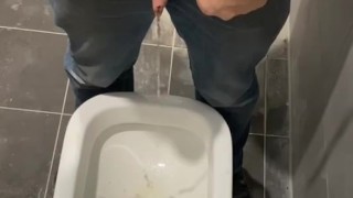 Man peeing in toilet 