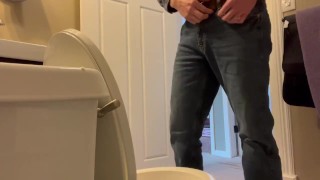 Candid shot of guy Pissing.