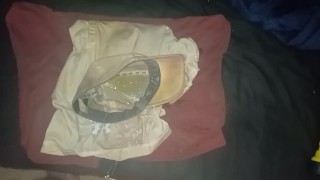 Pissing all over clothes before putting back on