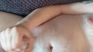 Laid naked on my sofa wanking my cock 