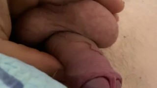 Dick man in bed play with balls