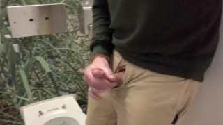 Jerking off and cumming in the airport bathroom before a flight.