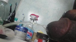 Big dick pissing side view