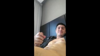 Handsome man oils his thick pink boner