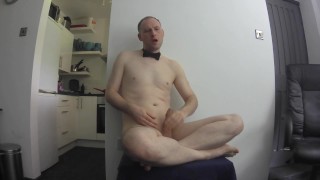 Kudoslong in just bow-tie, socks and shoes his shaved cock erect as he wanks