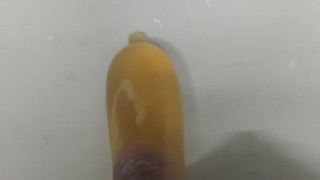 Cum and piss in a condom