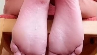 Cumshot on own soles - view from behind