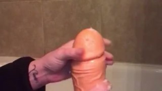 Oiling up my thick dildo