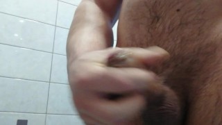 Hairy muscular man jerks off in the shower and has a great orgasm