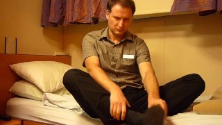 Kudoslong on a bed strips naked and pulls his foreskin and wanks his cock with his feet