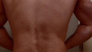 HAIRY MUSCLE BEAR FLEXING BEFORE SHOWER