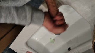 Big Cock Pisses in the Bathroom and then Jerks Off with Massage Body Oil
