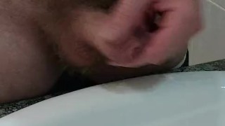 Woke uo horny and wanked in the bathroom