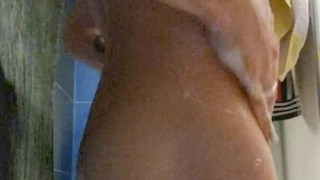 Sexy tattooed pierced twink taking a shower.