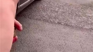 Naked at side of busy road cars passing 