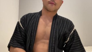 Asian boy in Jinbei stroking