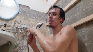 hot muscular guy washes in the shower 4k video