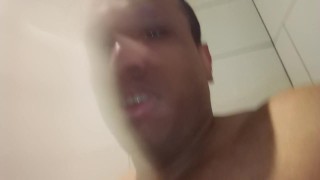 Big dick masturbates taking a shower
