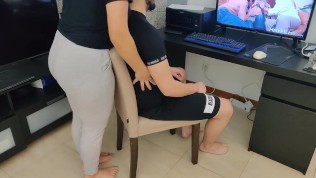 mature step-mom gives her stepson a handjob while watching porn