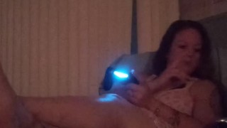 Cute busty Gamer girl playing Fortnite in dress