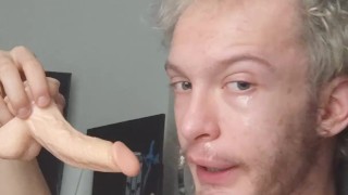 Skinny teen deepthroats and Gags on his 7 inch dildo