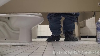 Caged sub offering his hole under the stall