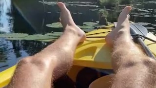 Hairy daddy long legs pumps his tight uncut cock in a kayak