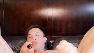Asian twink plugging up tight hole with butt plug