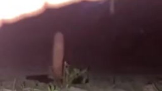 Riding big dildo on park trail