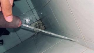 Pissing at the public dirty bathroom edge