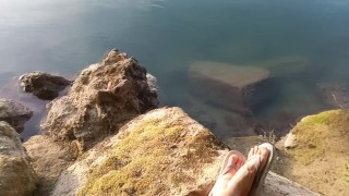 Boy cumming on his feet in flip flops after wanking outdoors. Foot fetish video