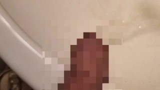 Hairy Japanese men pees foreskin with erect penis.