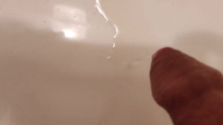 Taking a leak in the sink at work