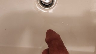 Taking a leak in the sink at work
