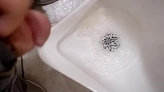 Pissing at a grocery store mens room