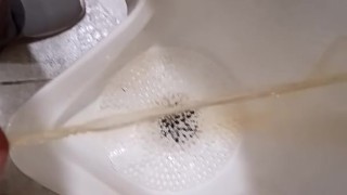 Pissing at a grocery store mens room