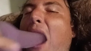 Sean teasing with a purple dildo