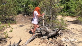 redhead milf pissing in the woods standing on a log 4K 60fps