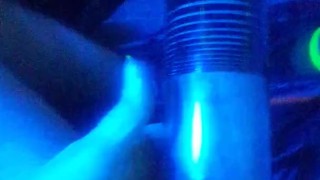 pumping dick and balls into penis pump under blue light