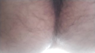 A hairy Japanese man squats and masturbates. The contraction of his anus at moment of ejaculation