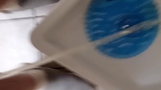 Sean pissing in amusement park mens room