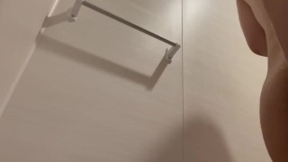 Chubby Japanese man inserts wall-mounted dildo into anus
