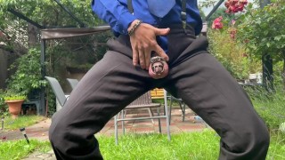Suited man is playing with his mancunt in public 