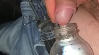 Bi guy fills 2 bottles on highway