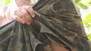 Uncut cock peeing outside in a sitting position without pulling foreskin