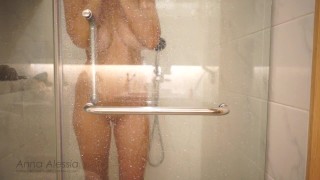 I TAKE A SHOWER AND CARESS MY BREASTS