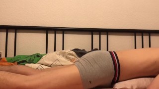 Cute boi humping on his bed cumming in condom