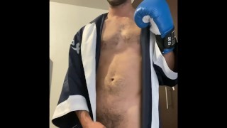 Gay jerking off with boxing gloves.